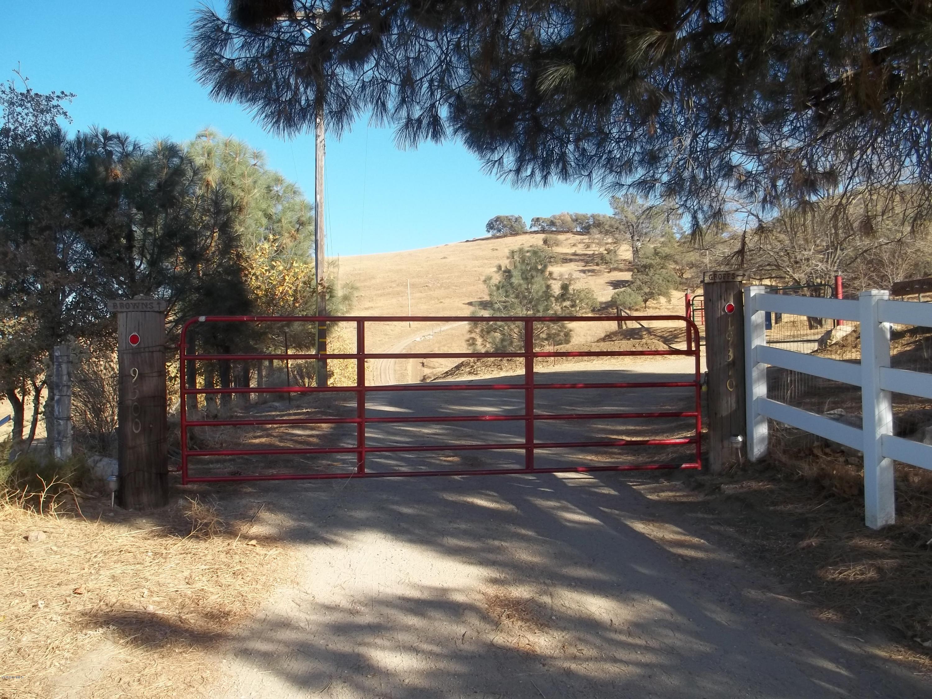 19370 Water Canyon Road Tehachapi, CA 93561 - Photo 1 of 38 a view of a yard with wooden fence