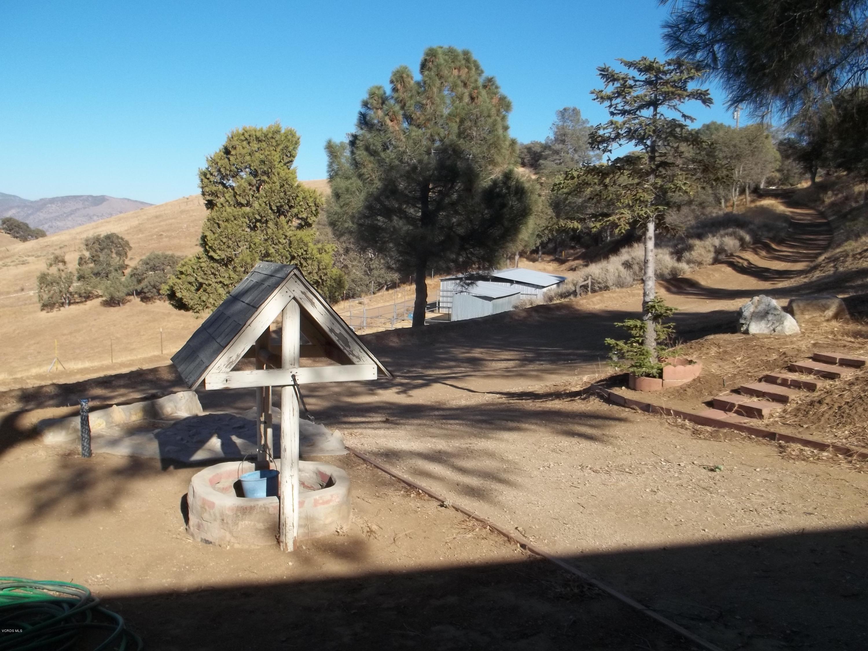 19370 Water Canyon Road Tehachapi, CA 93561 - Photo 2 of 38 a view of a house with a yard