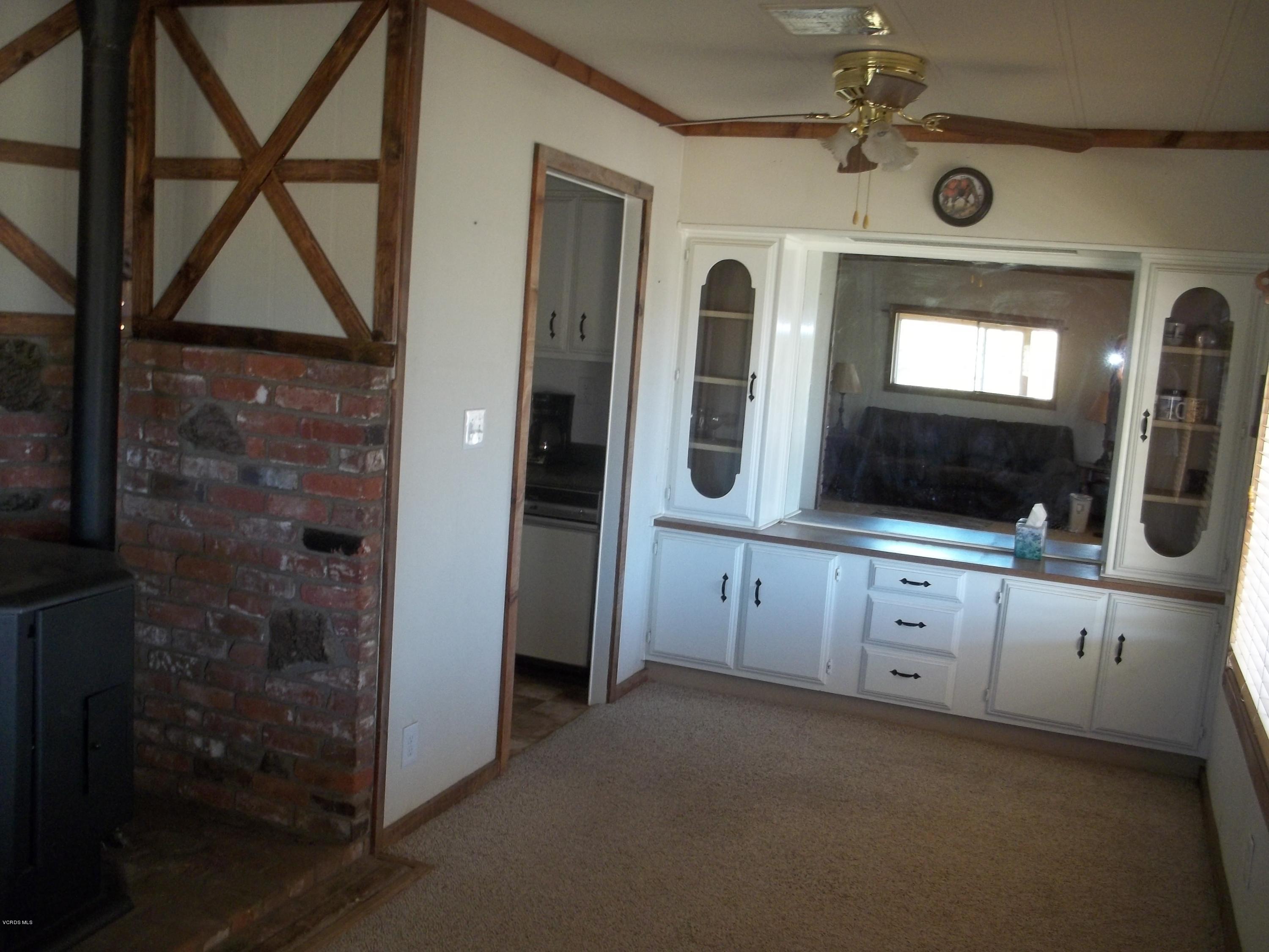 19370 Water Canyon Road Tehachapi, CA 93561 - Photo 21 of 38 a bathroom with a double vanity sink mirror and shower