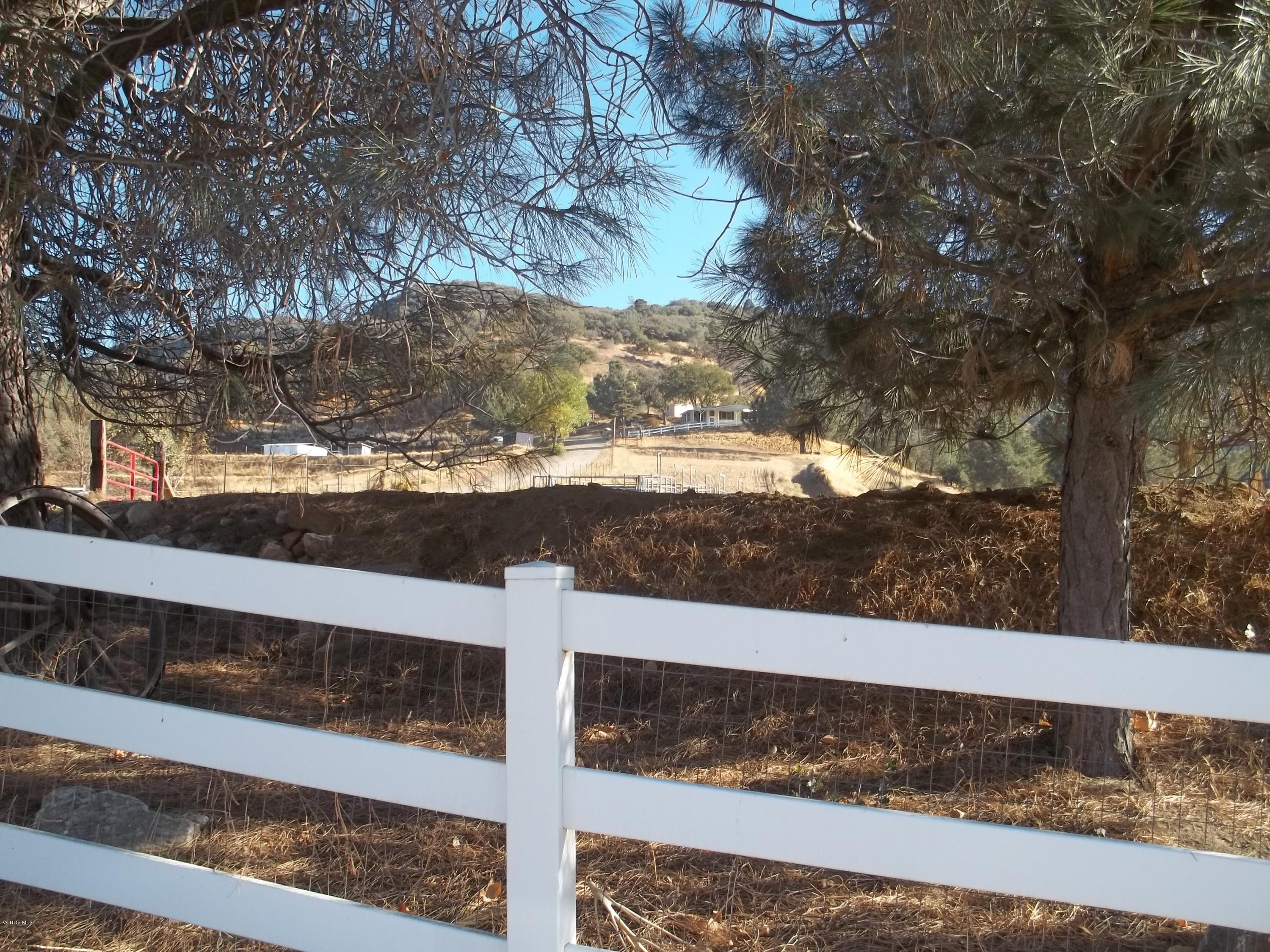 19370 Water Canyon Road Tehachapi, CA 93561 - Photo 4 of 38 a view of a wooden fence