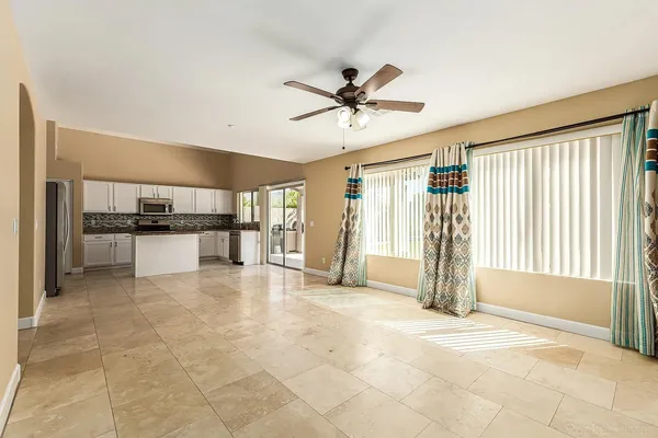 a view of a kitchen with a sink and a window