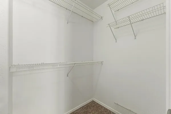 a view of a room with racks on the wall