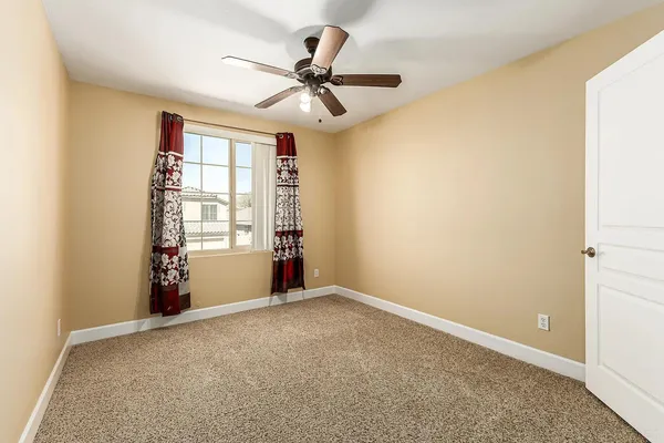 a view of an empty room with a window