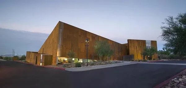 a room with lots of table and chairs