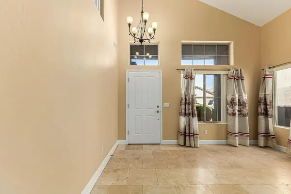 a view of a hallway with a chandelier