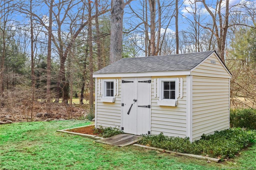183 Frogtown Road New Canaan, CT 06840 - Photo 32 of 37 a view of a house with backyard