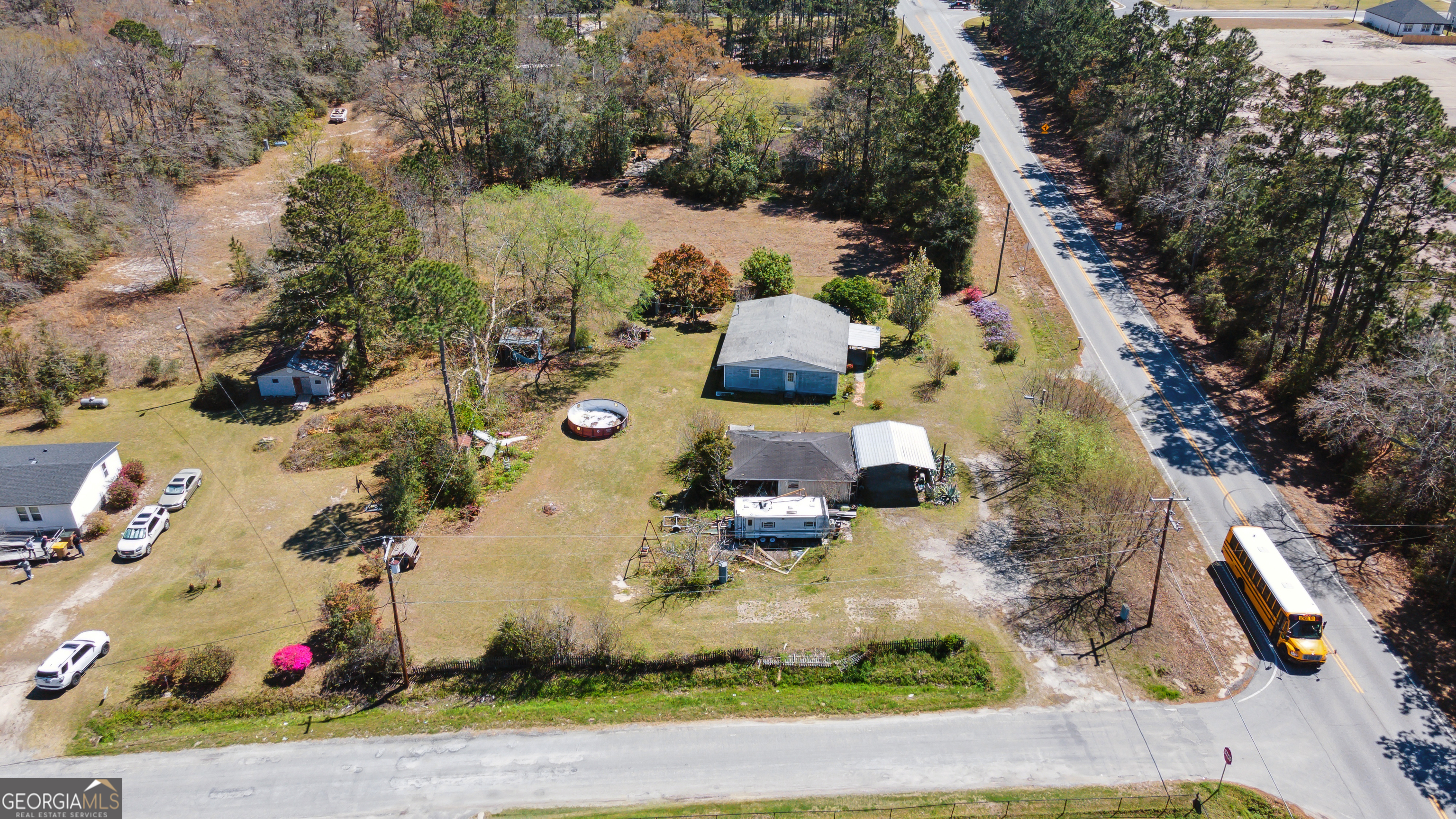 an aerial view of a house with a yard