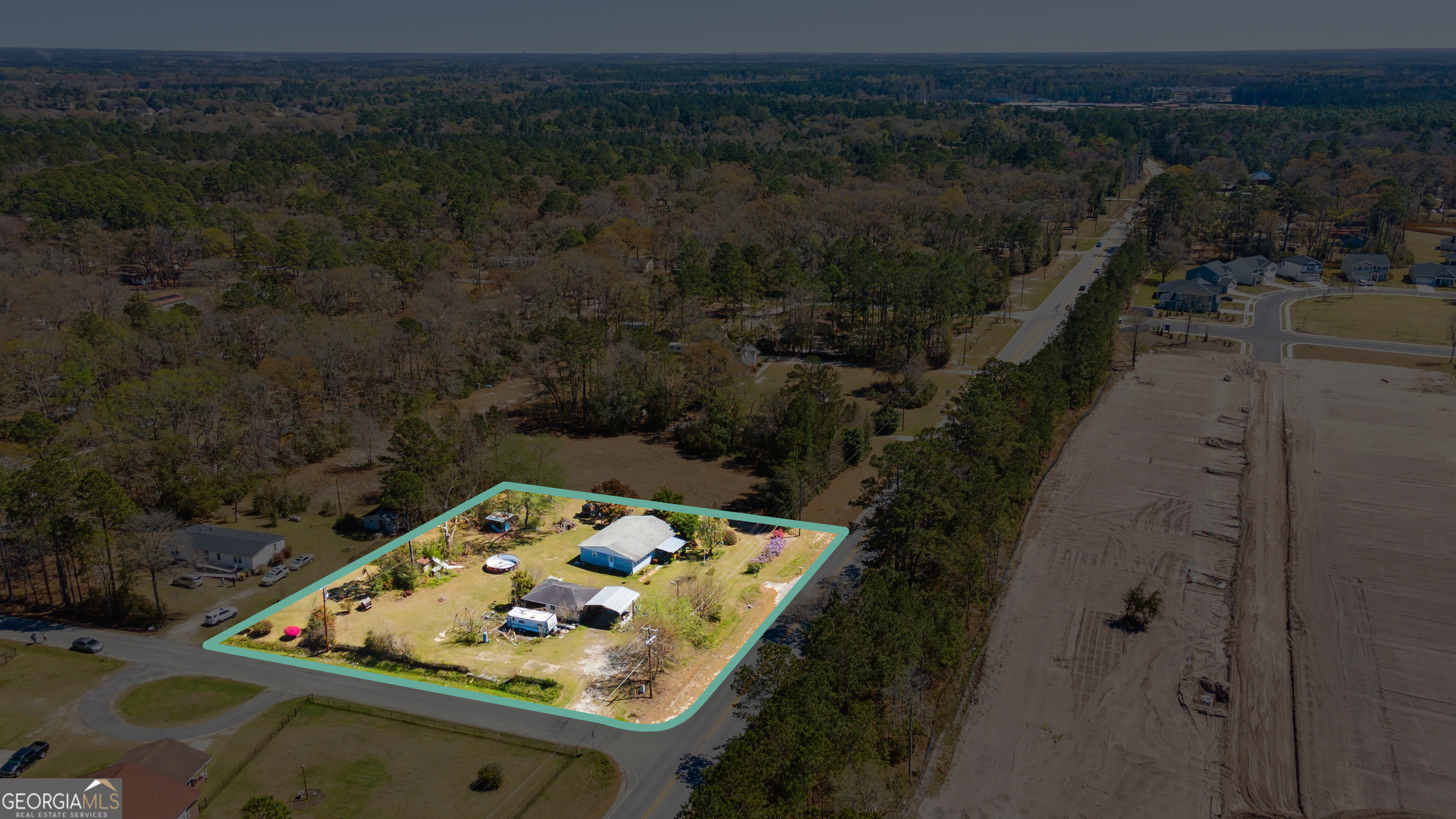 717 Noel C Conaway Road Guyton, GA 31312 - Photo 15 of 15 an aerial view of house with outdoor space