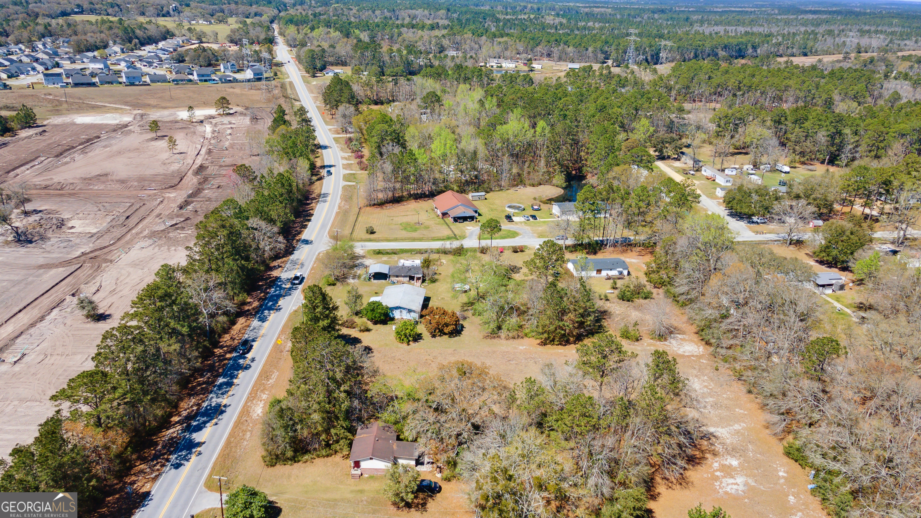 717 Noel C Conaway Road Guyton, GA 31312 - Photo 5 of 15 an aerial view of residential houses with outdoor space