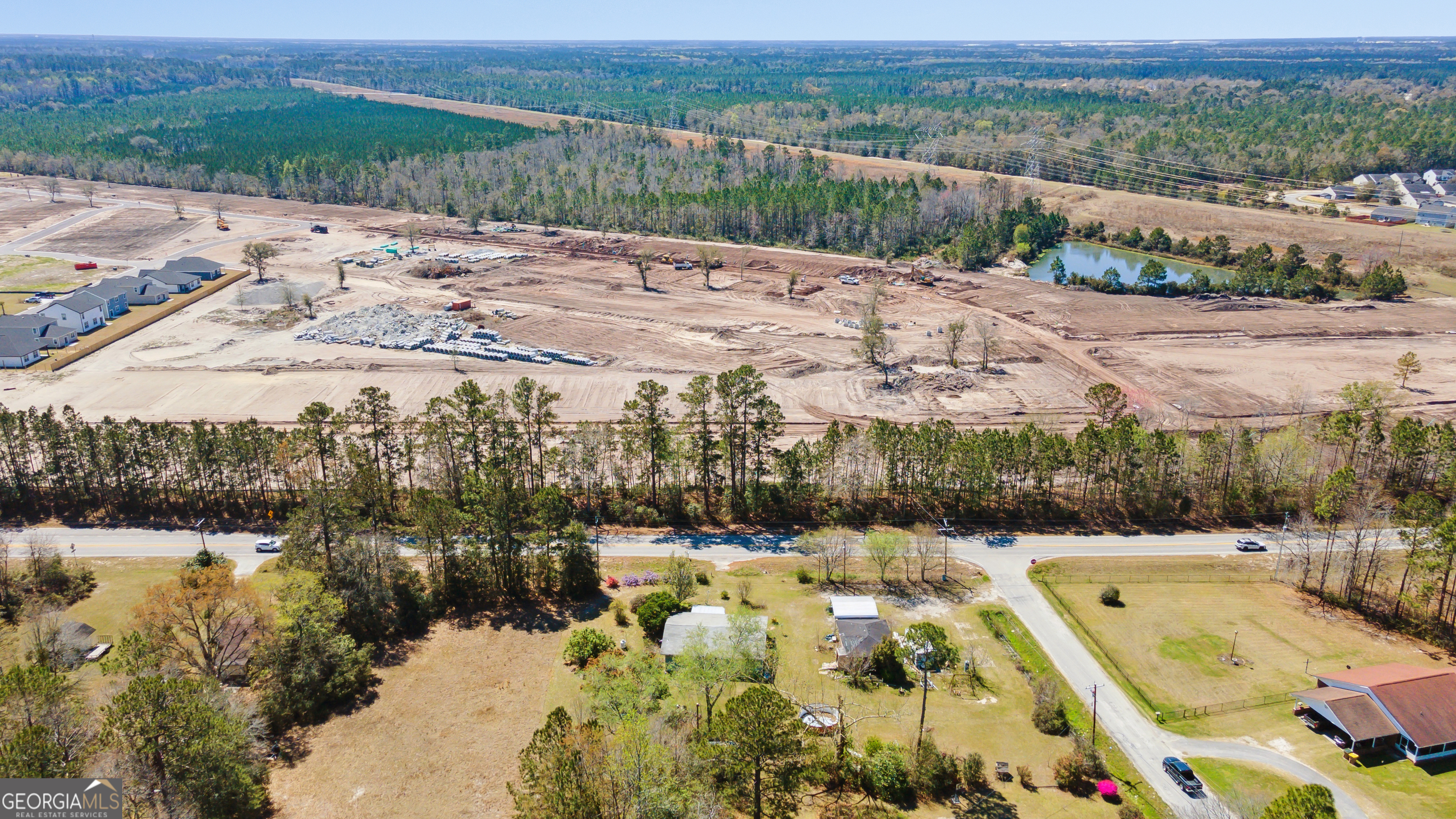 717 Noel C Conaway Road Guyton, GA 31312 - Photo 7 of 15 a view of a swimming pool with a yard