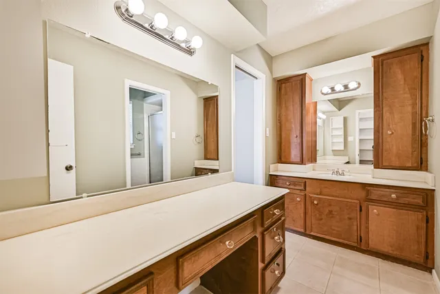 a room with a sink and a mirror