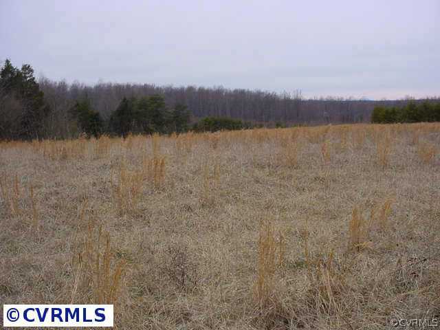 709 Holland Road Farmville, VA 23901 - Photo 3 of 5 a view of a lake with houses in the back