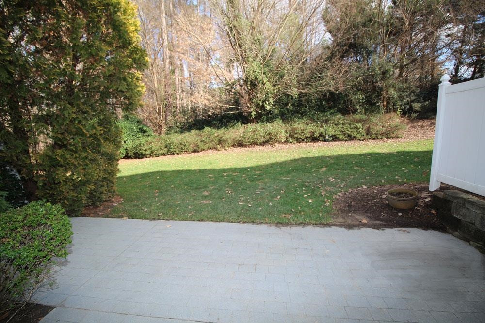 6952 Middleboro Drive Raleigh, NC 27612 - Photo 28 of 32 Enjoy peaceful, private patio, backing up to HOA green space. Patio