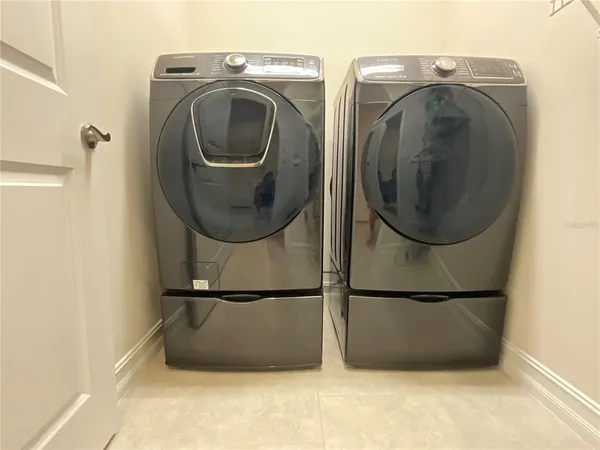 a utility room with dryer and washer