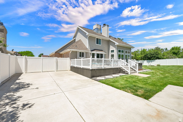 4792 Glasmann Way South Ogden, UT 84403 - Photo 22 of 70 Expansive concrete driveway with privacy fencing with large drive through gate and a spacious rear deck