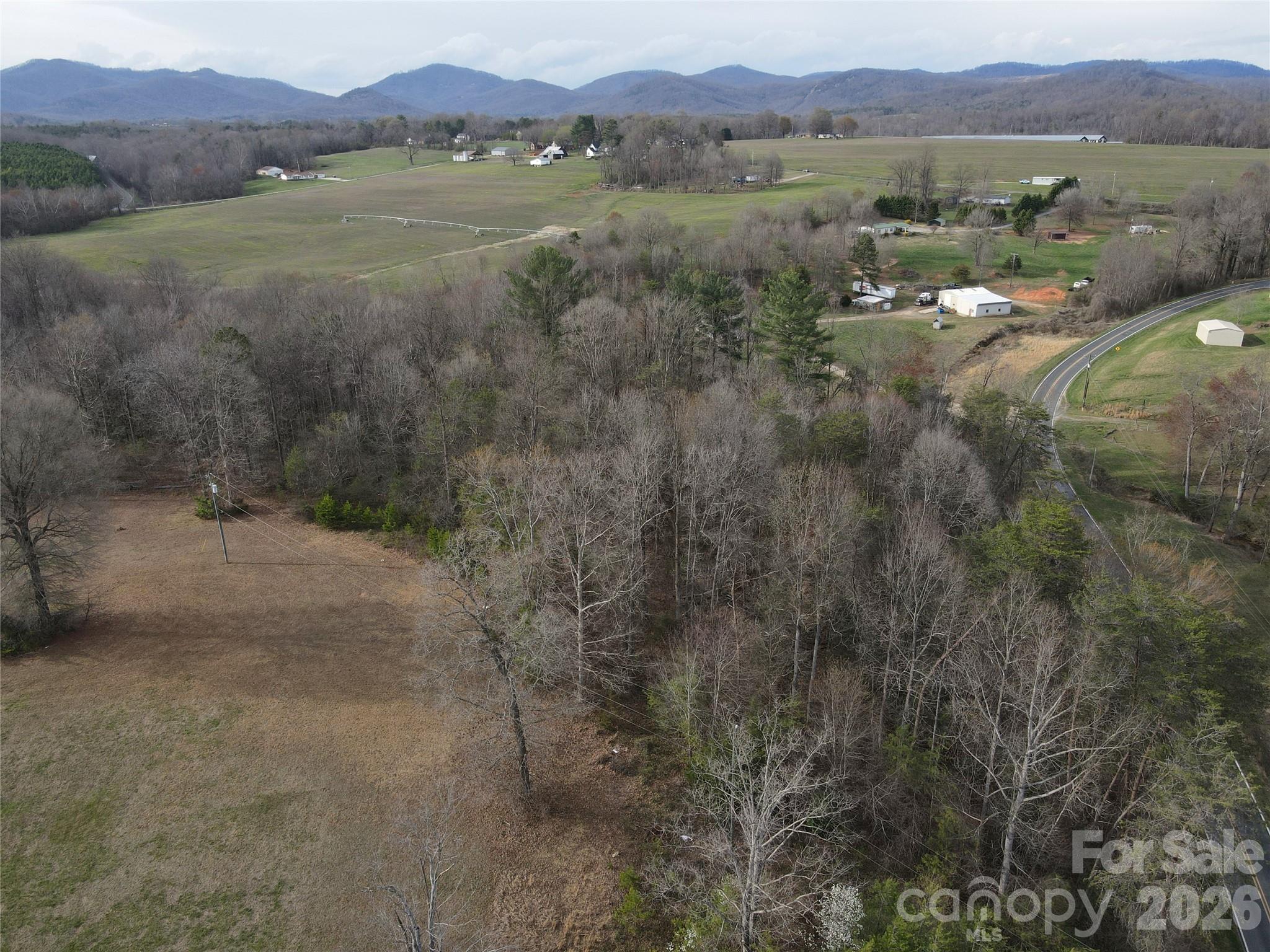 0 Vashti Road Hiddenite, NC 28636 - Photo 15 of 38 a view of lake with mountain and trees around