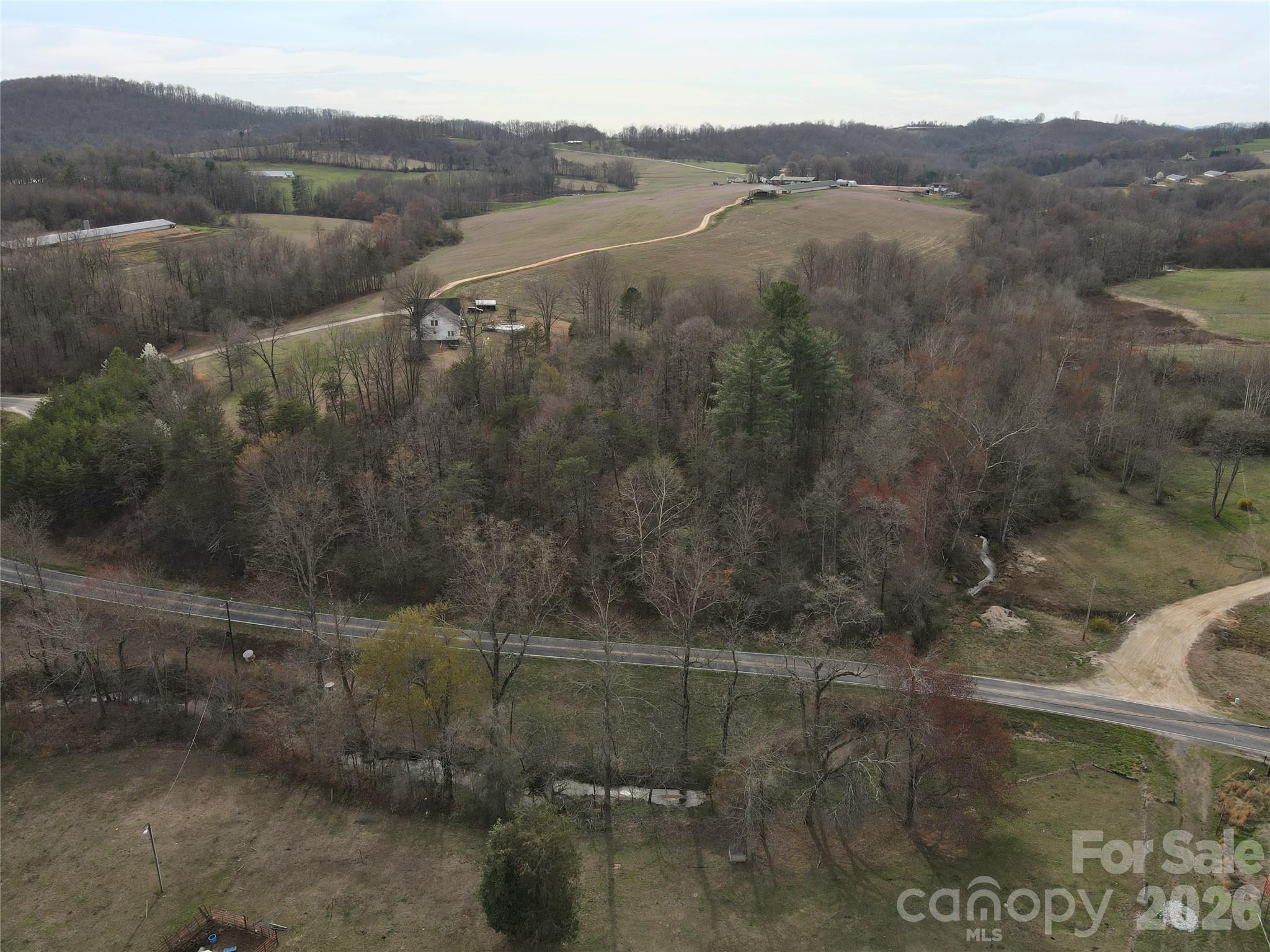 0 Vashti Road Hiddenite, NC 28636 - Photo 16 of 38 a view of a lake in middle of the town