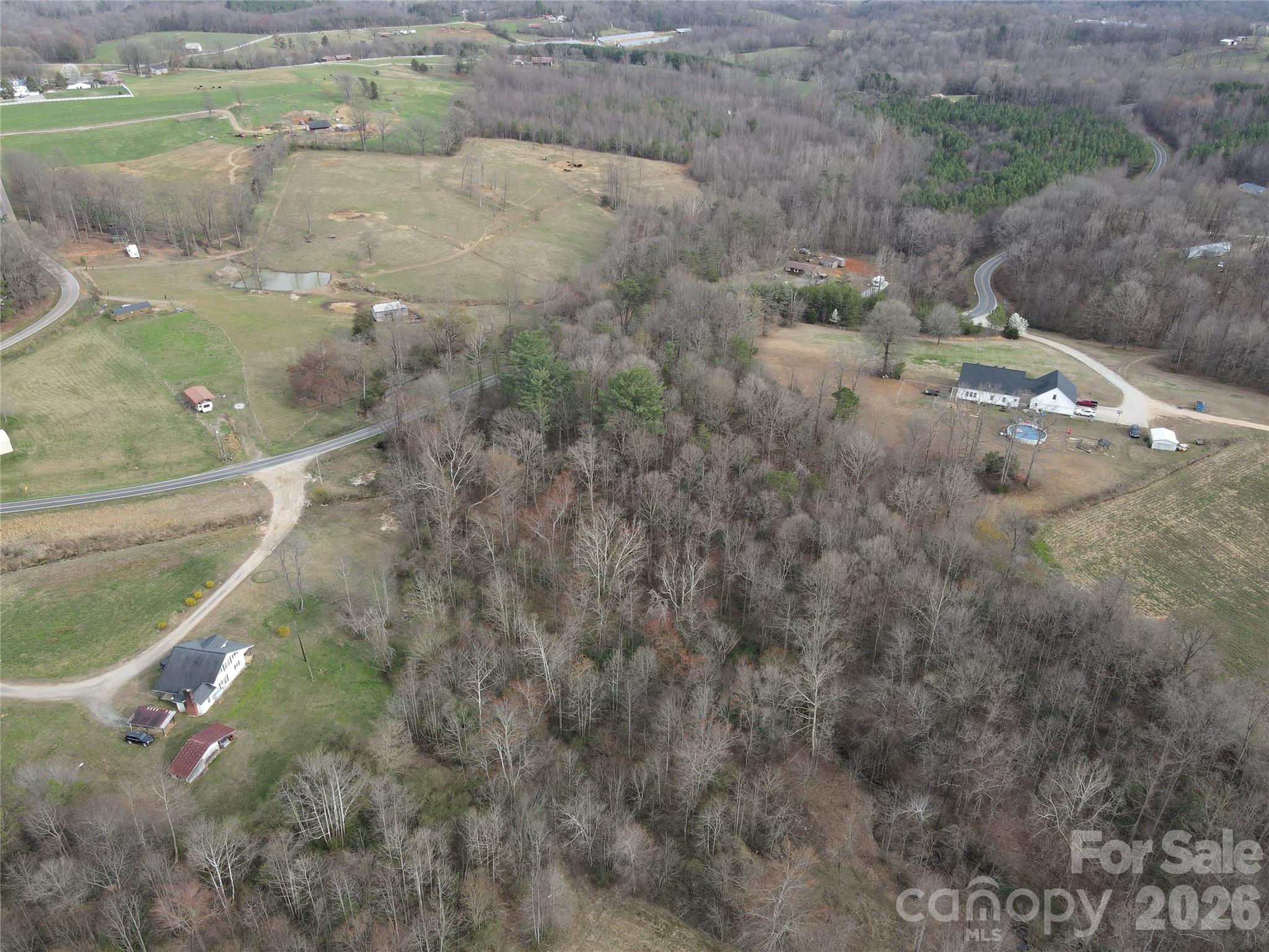 0 Vashti Road Hiddenite, NC 28636 - Photo 10 of 38 a aerial view of a houses with yard