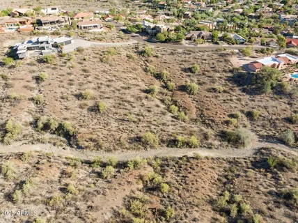 an aerial view of residential building and ocean
