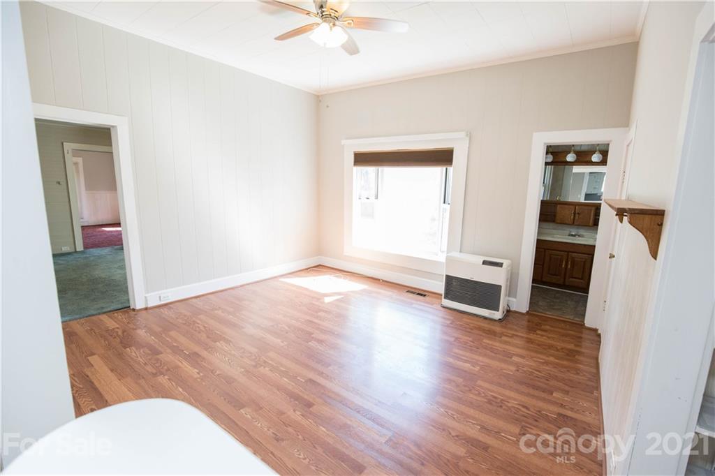 200 Hiddenite Church Road Hiddenite, NC 28636 - Photo 16 of 20 wooden floor in an empty room with a bathroom