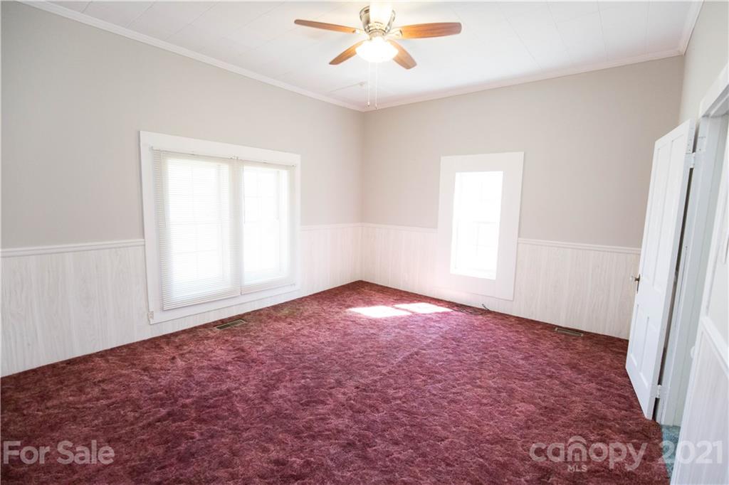 200 Hiddenite Church Road Hiddenite, NC 28636 - Photo 19 of 20 an empty room with a ceiling fan and window