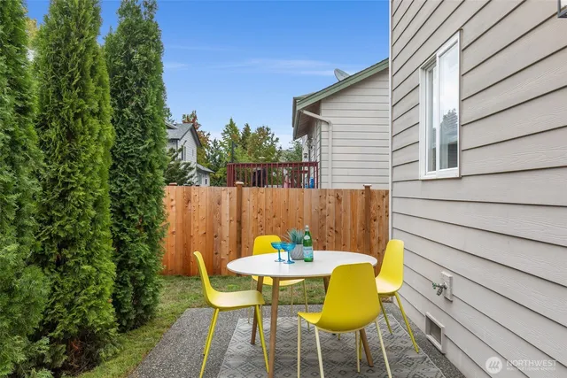 a view of a table and chairs in the patio