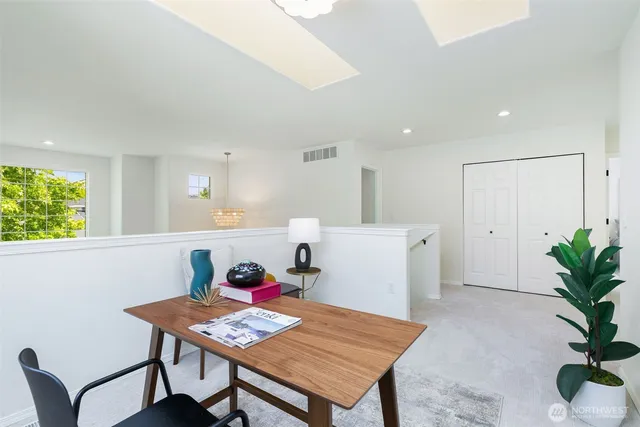 a bed room with a bed and a potted plant