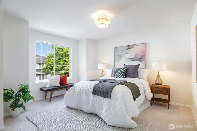 a bedroom with a bed and window