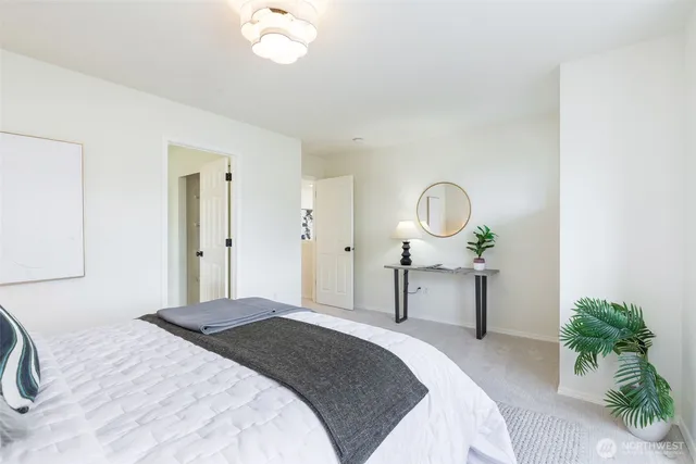 a bathroom with a granite countertop sink mirror and a bathtub