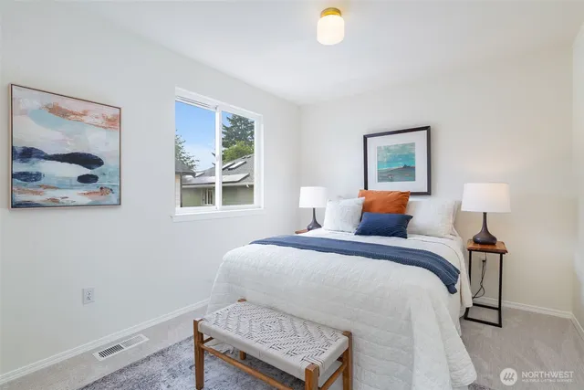 a bathroom with a toilet a sink and a mirror