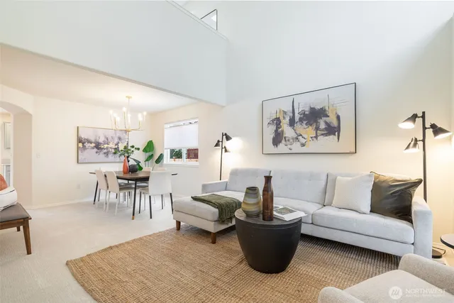 a living room with furniture and a table