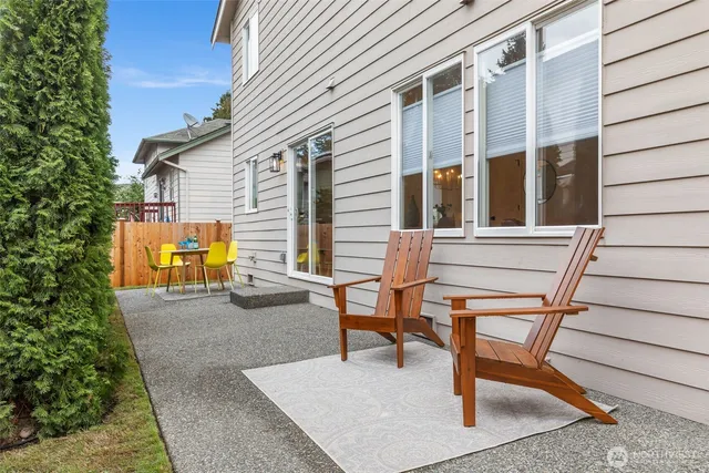 a view of a table and chairs in the patio