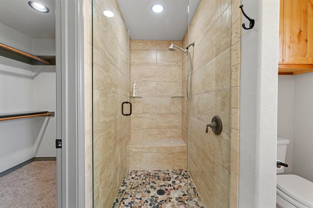 2387 County Road 407 Nemo, TX 76070 - Photo 16 of 30 a bathroom with a shower and a toilet