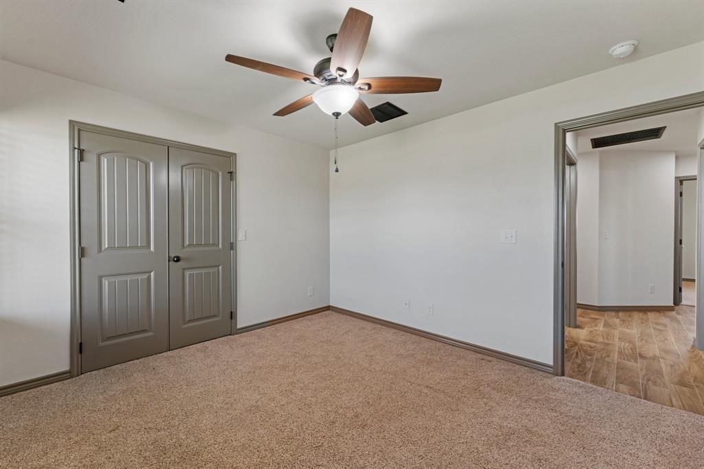 2387 County Road 407 Nemo, TX 76070 - Photo 19 of 30 a view of an empty room and chandelier fan