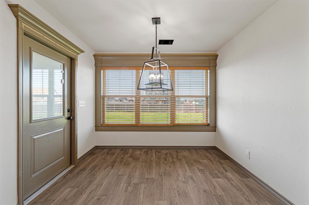 2387 County Road 407 Nemo, TX 76070 - Photo 24 of 30 a view of an empty room with wooden floor and a window