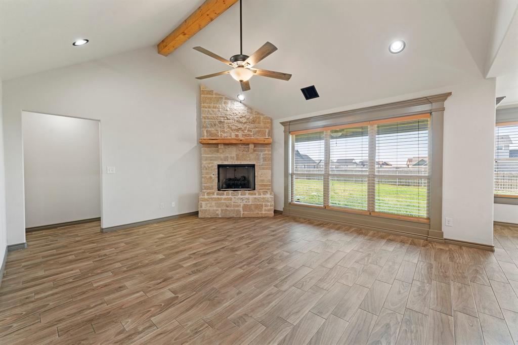 2387 County Road 407 Nemo, TX 76070 - Photo 5 of 30 a view of an empty room with wooden floor and a window
