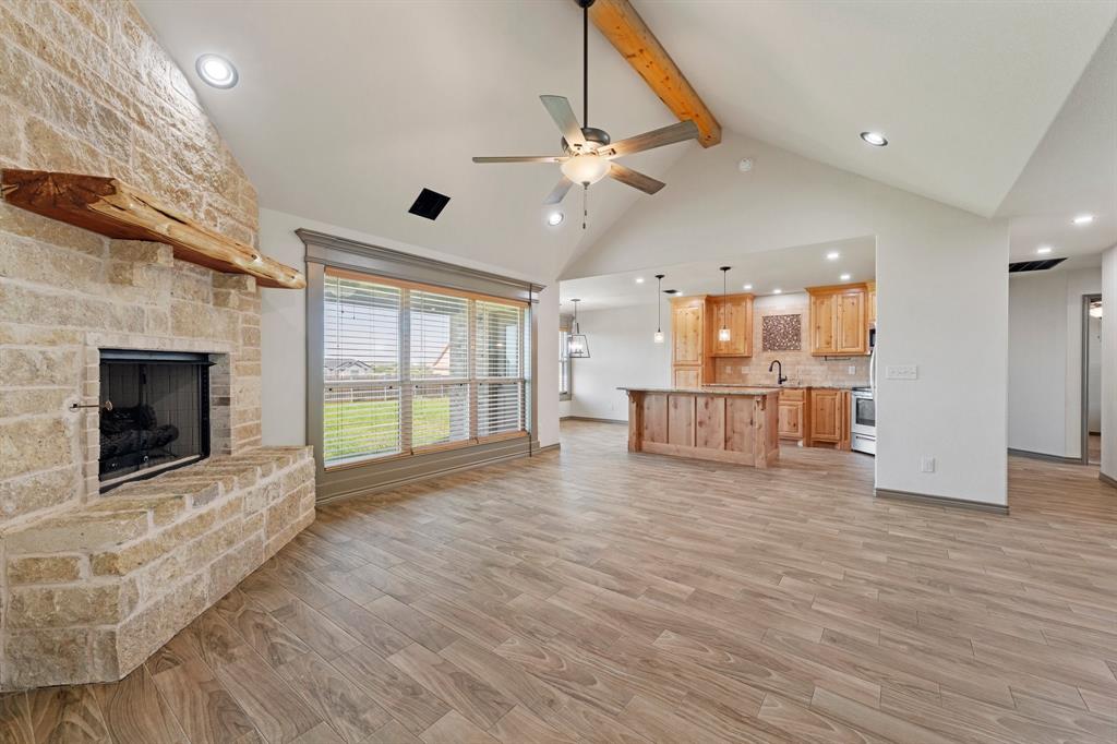 2387 County Road 407 Nemo, TX 76070 - Photo 7 of 30 a view of a big room with wooden floor and a fireplace