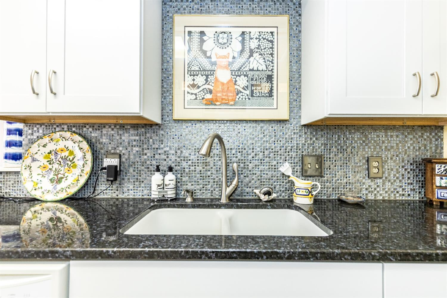 5221 84th Street Lubbock, TX 79424 - Photo 17 of 42 a bathroom with a granite countertop sink and a mirror
