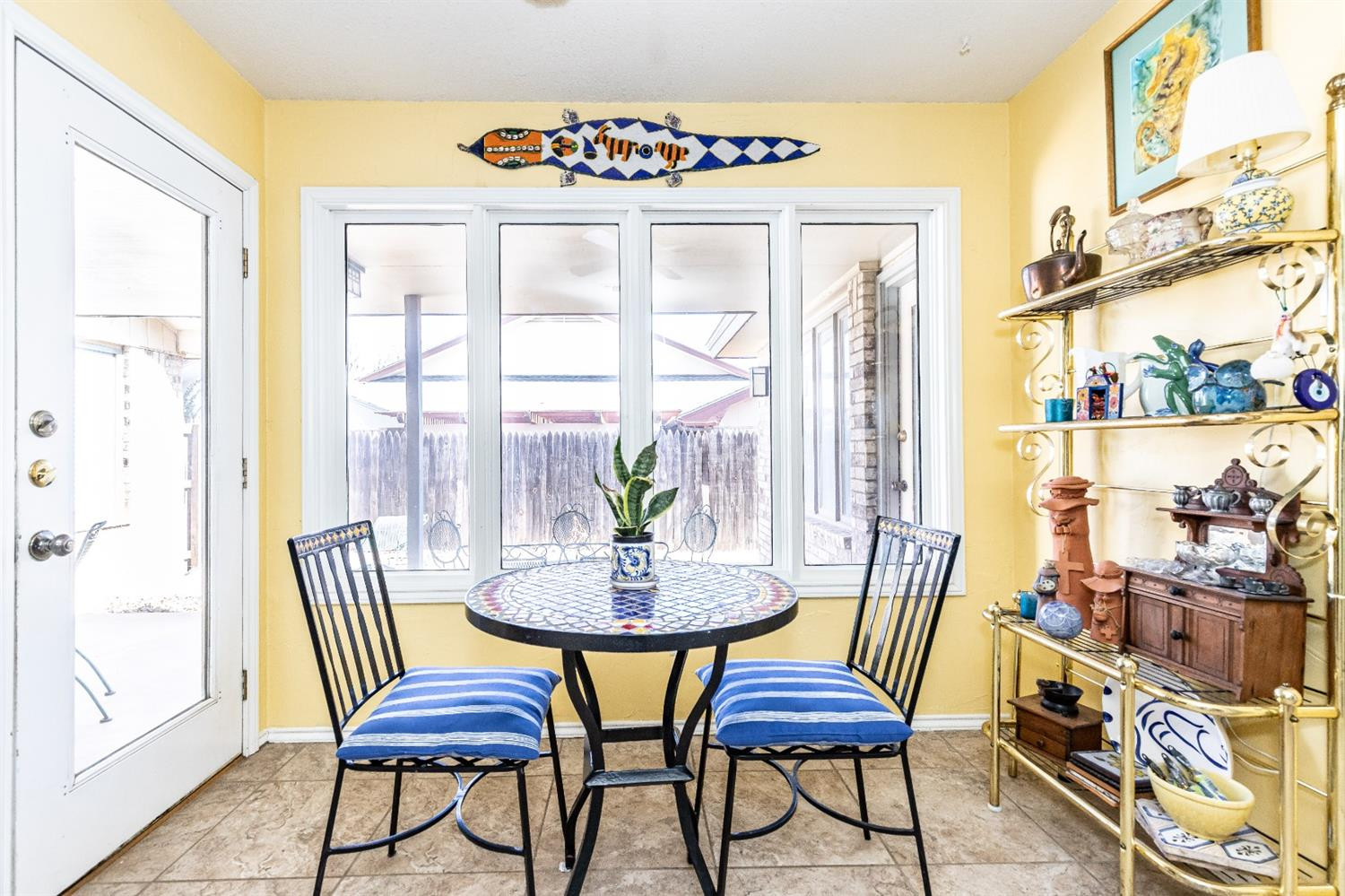 5221 84th Street Lubbock, TX 79424 - Photo 19 of 42 a view of a dining room with furniture window and outside view