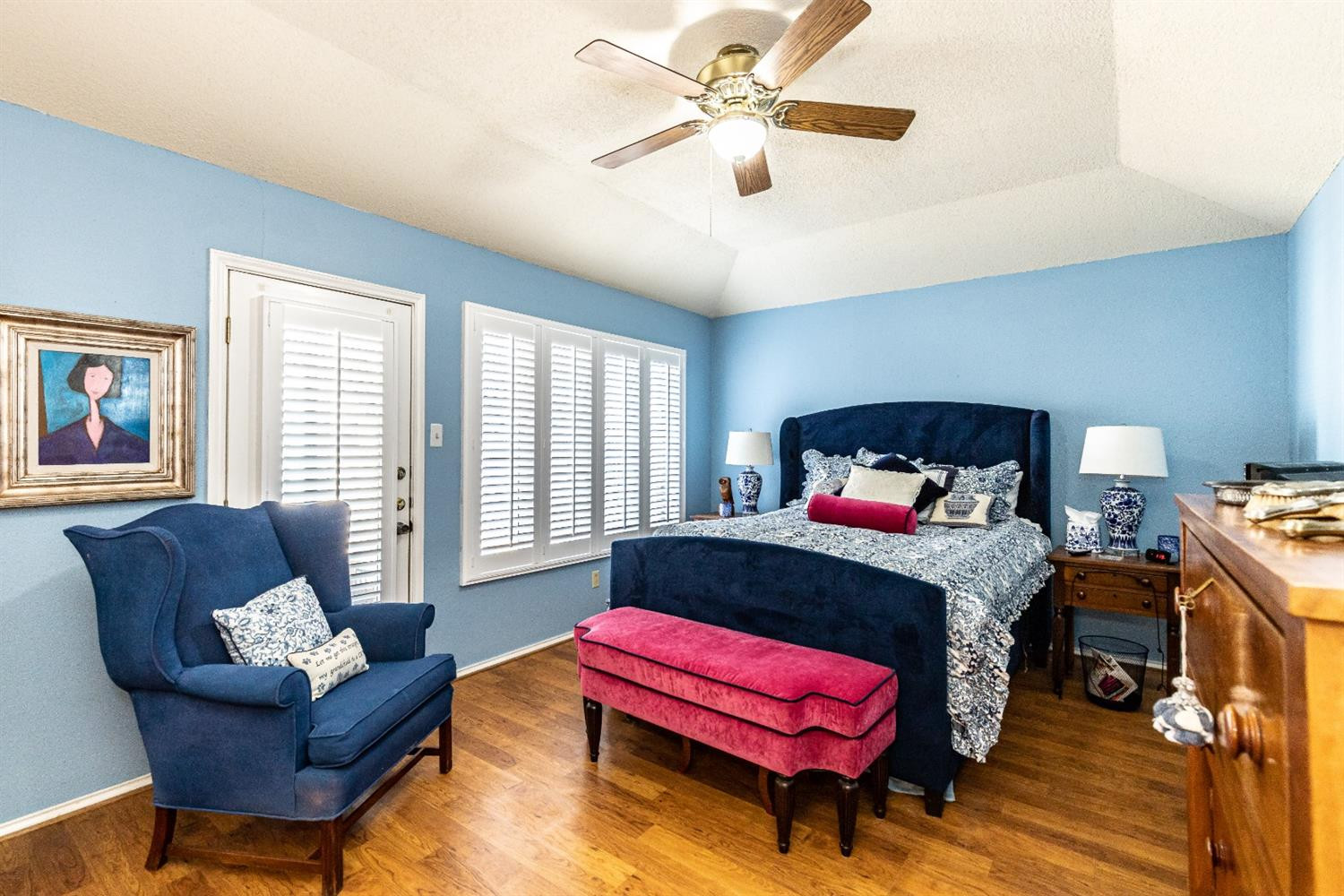 5221 84th Street Lubbock, TX 79424 - Photo 21 of 42 a bedroom with a bed and wooden floor