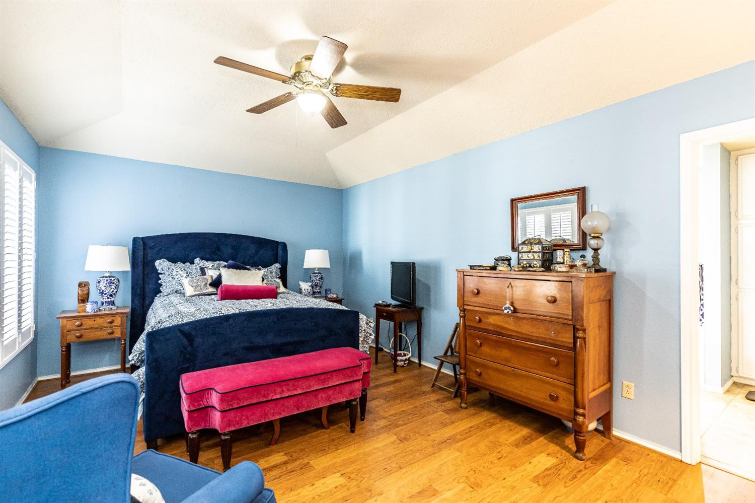 5221 84th Street Lubbock, TX 79424 - Photo 22 of 42 a bedroom with a bed and a chandelier