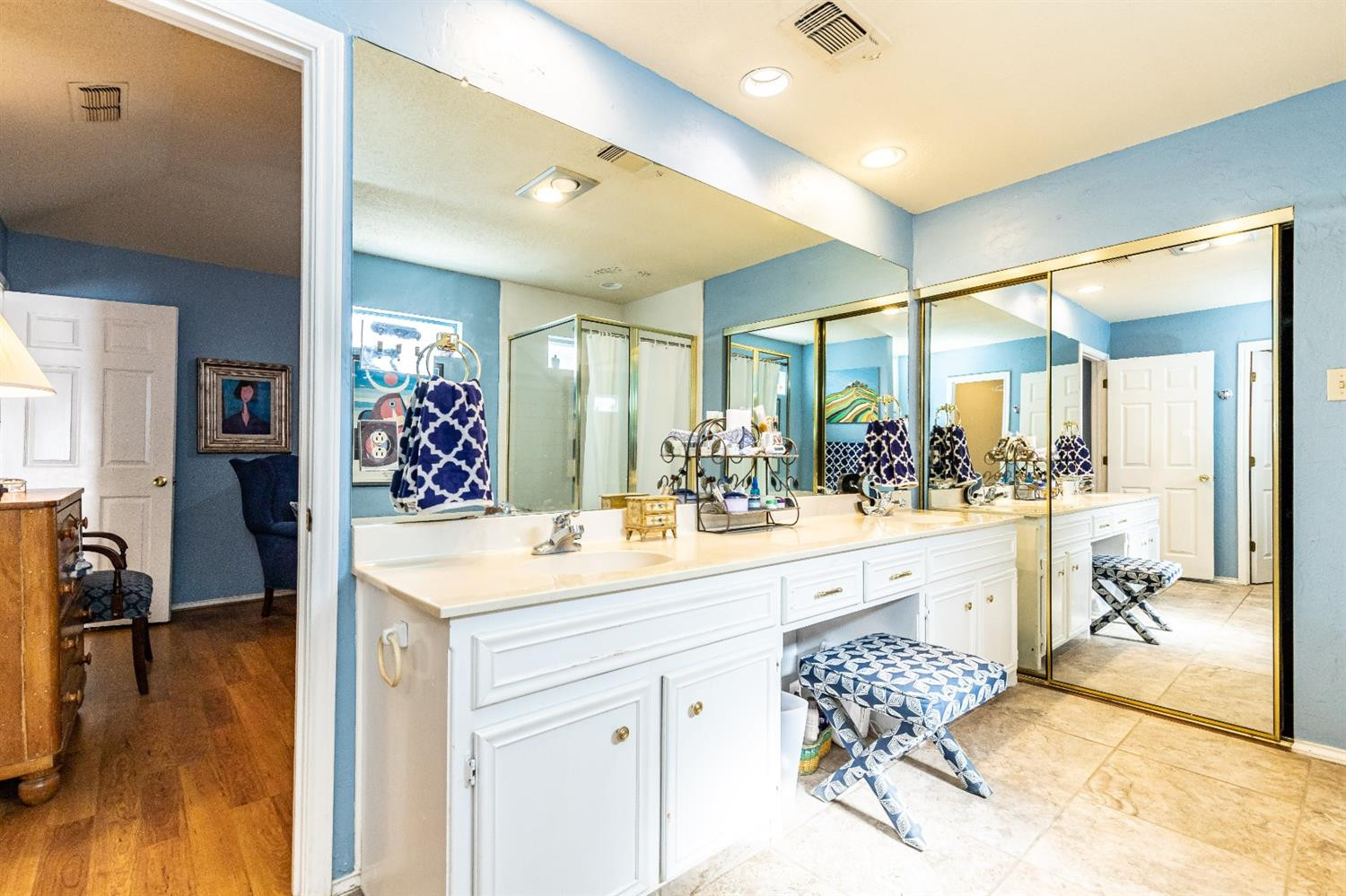 5221 84th Street Lubbock, TX 79424 - Photo 23 of 42 a large bathroom with a sink mirror and a bath tub