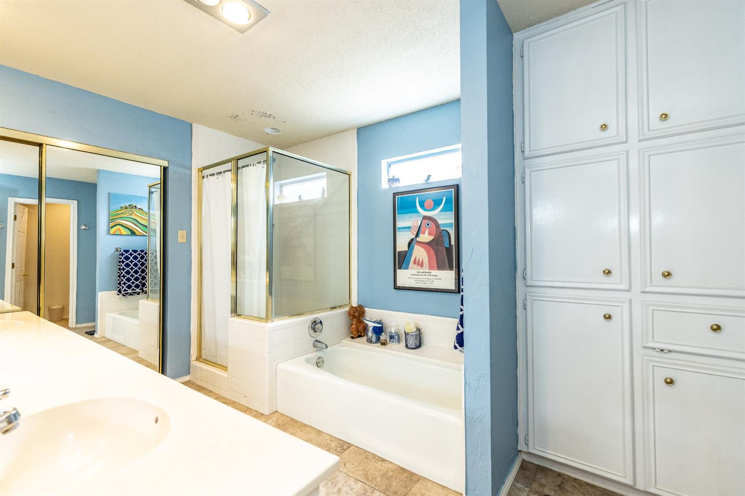 5221 84th Street Lubbock, TX 79424 - Photo 24 of 42 a en suite bathroom with a tub and shower