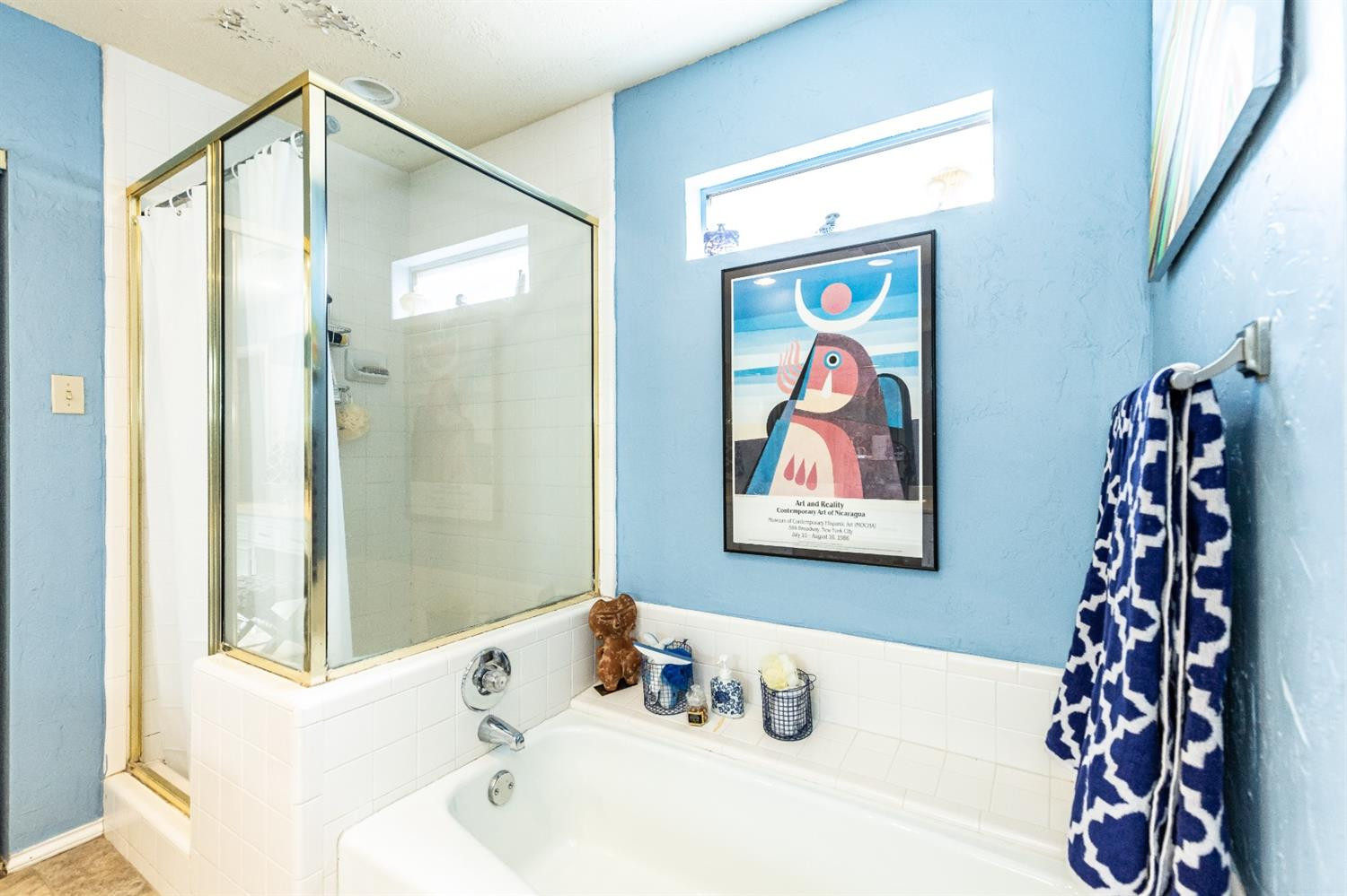 5221 84th Street Lubbock, TX 79424 - Photo 25 of 42 a bathroom with a bathtub and a shower