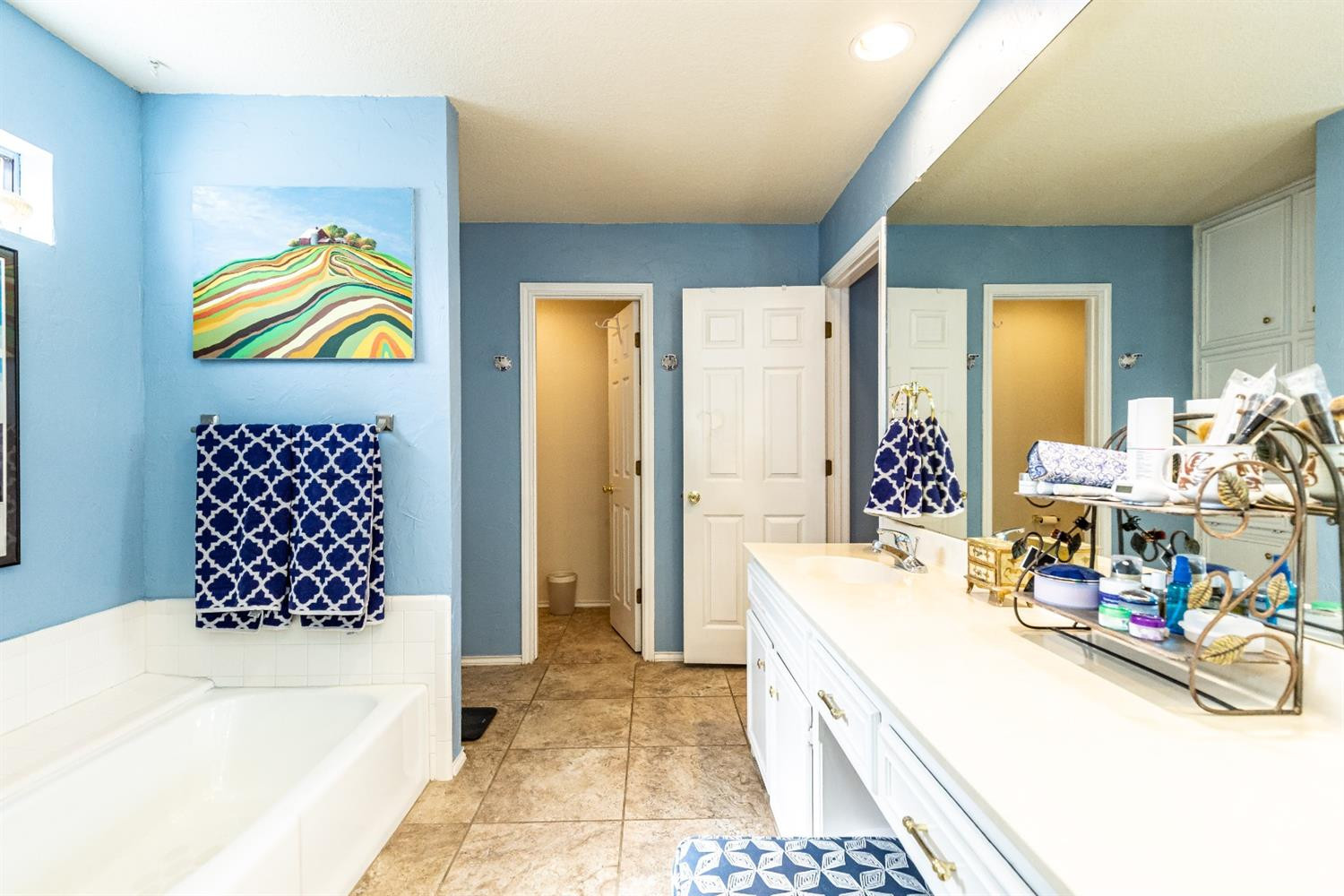 5221 84th Street Lubbock, TX 79424 - Photo 26 of 42 a bed room with a bed and a couch