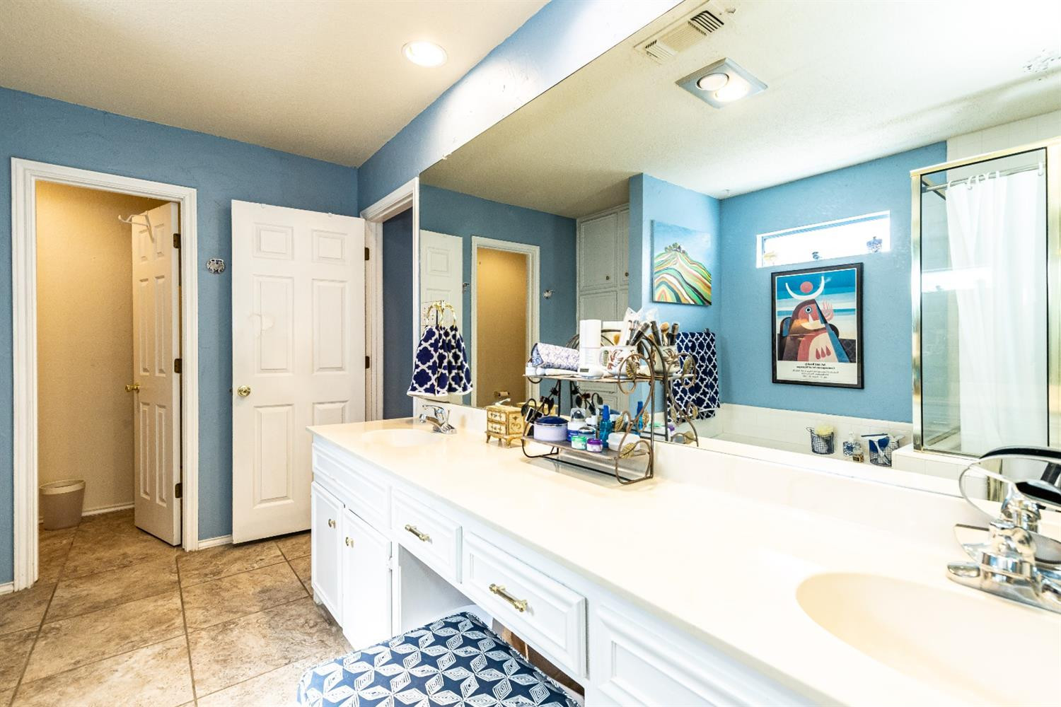 5221 84th Street Lubbock, TX 79424 - Photo 27 of 42 a bathroom with a sink double vanity and a mirror