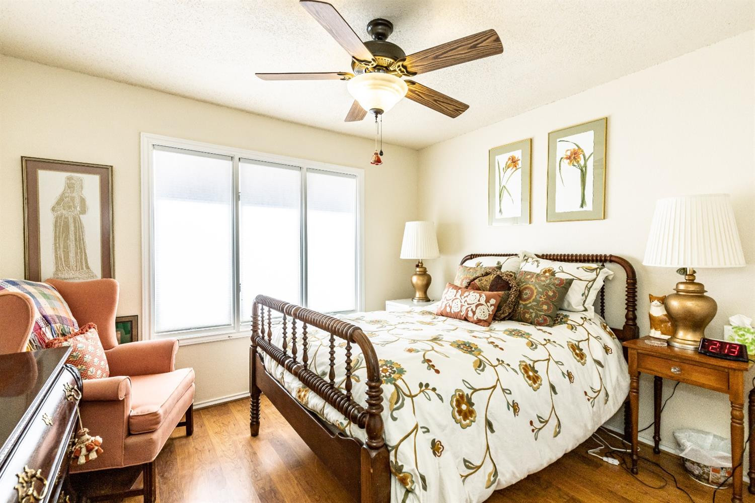 5221 84th Street Lubbock, TX 79424 - Photo 28 of 42 a bedroom with a bed and wooden floor