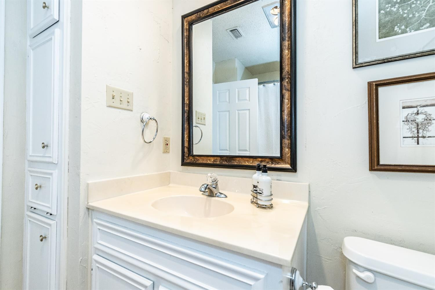 5221 84th Street Lubbock, TX 79424 - Photo 30 of 42 a bathroom with a sink and a mirror