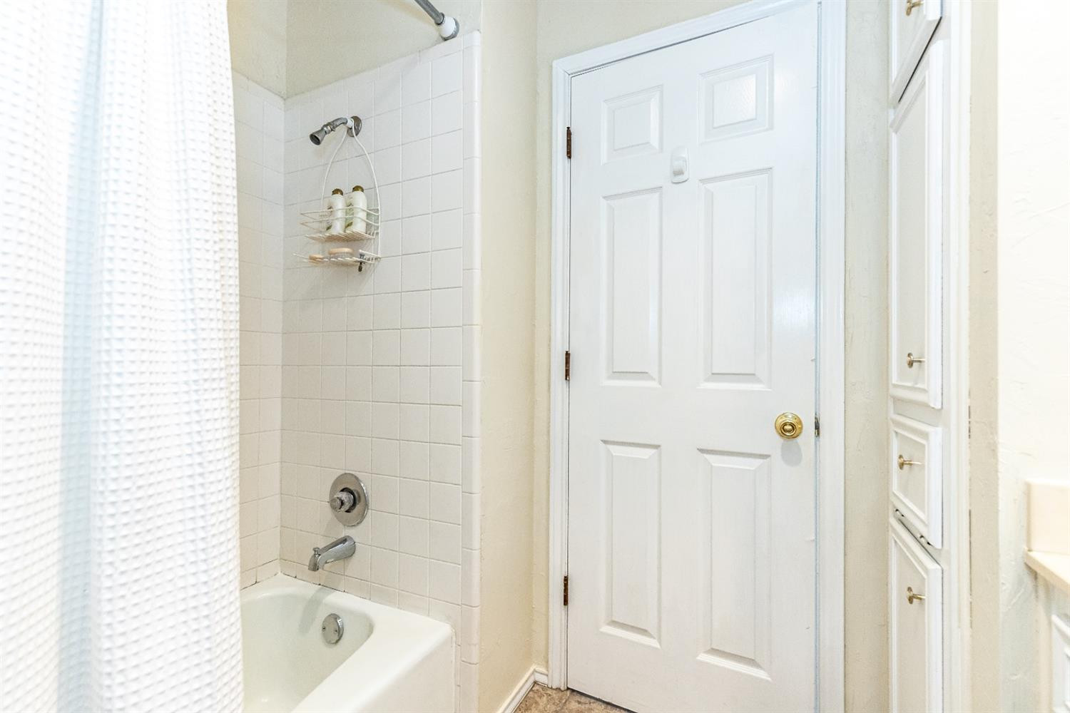 5221 84th Street Lubbock, TX 79424 - Photo 31 of 42 a bathroom with a tub shower vanity and a sink