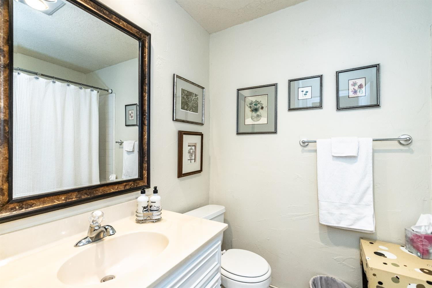 5221 84th Street Lubbock, TX 79424 - Photo 32 of 42 a bathroom with a sink toilet and vanity